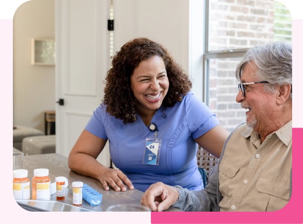 Homecare worker smiling at her client