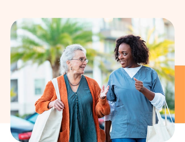 Home care worker and her client shopping